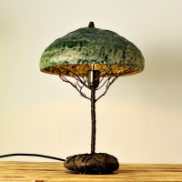 Metal table lamp with a stone stand